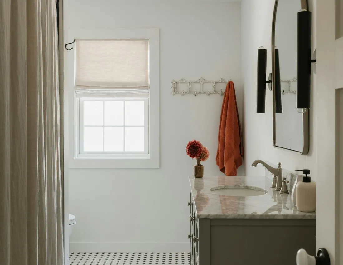 A bathroom vanity and tiled floor